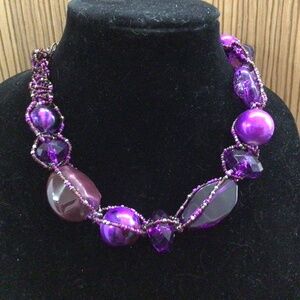 Purple large beaded necklace.